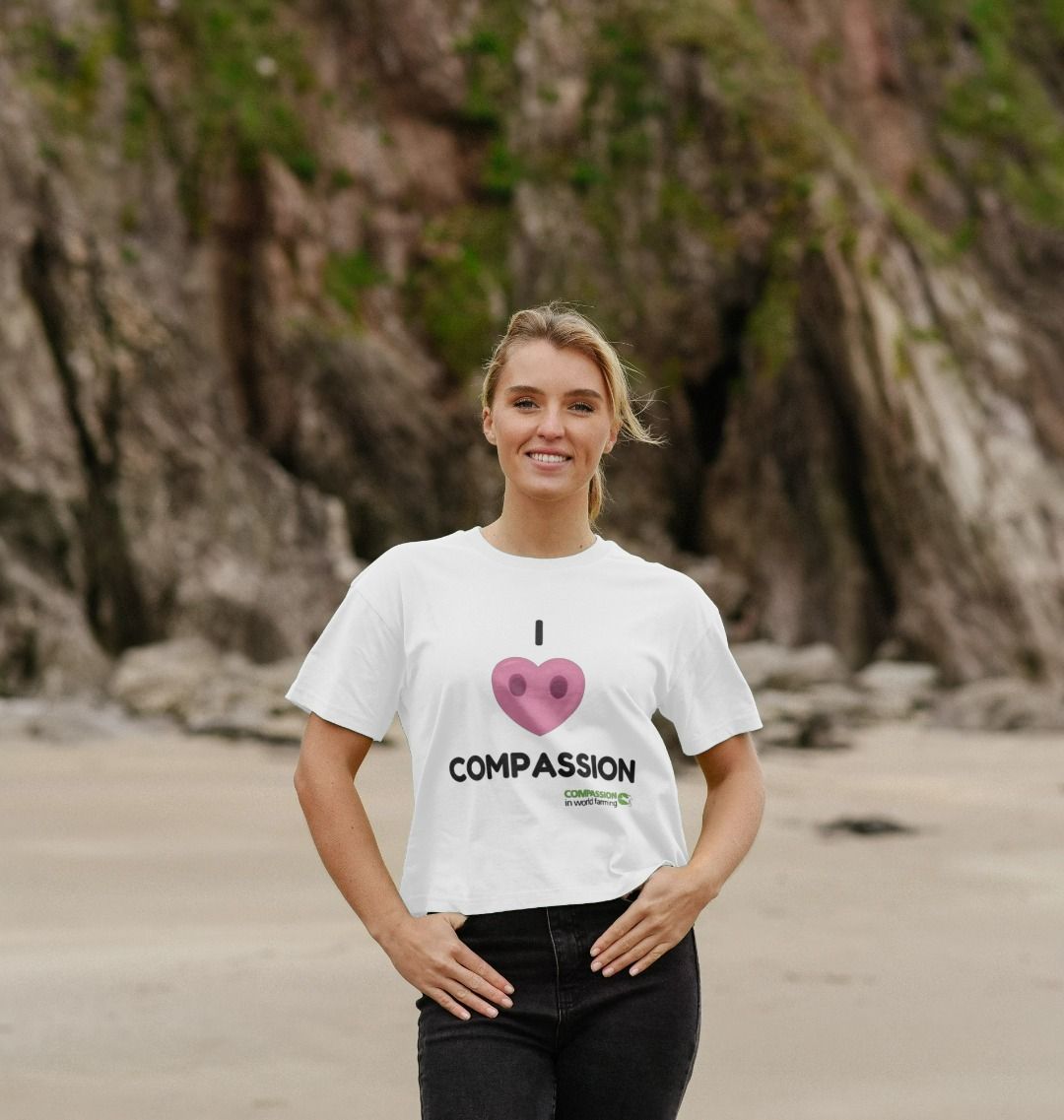 Female model wearing Compassion heart t-shirt at the beach